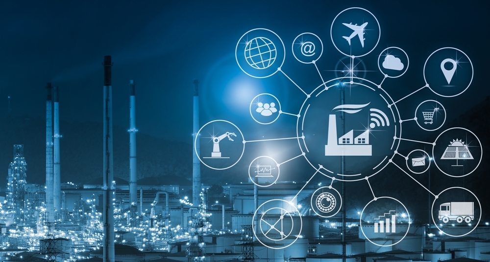 Icon wheel showing manufacturing and transportation icons overlaying an image of a industrial factory with smoke stacks