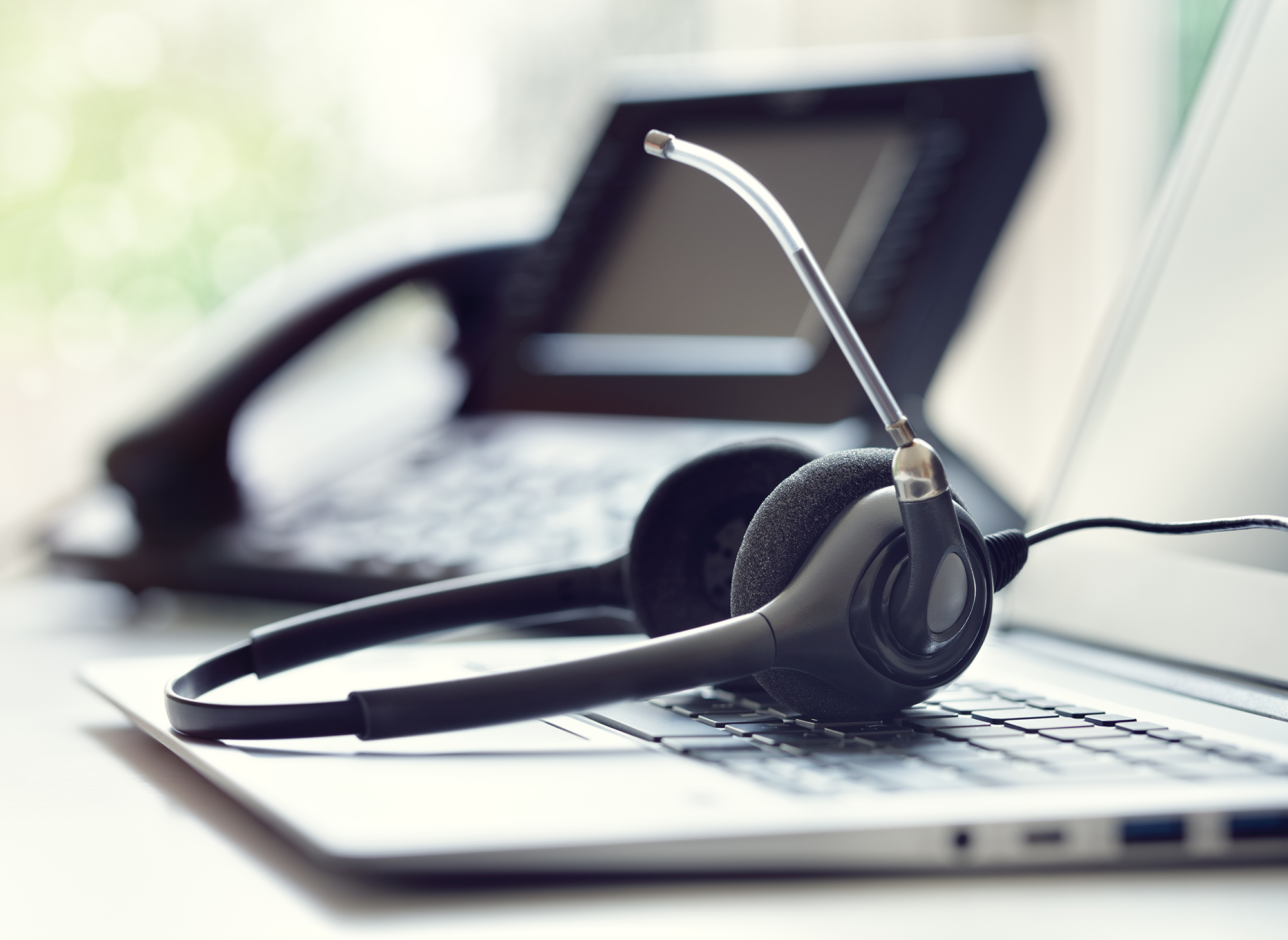 jacs-solutions-tech-support-headset-sitting-on-table-2000x1460