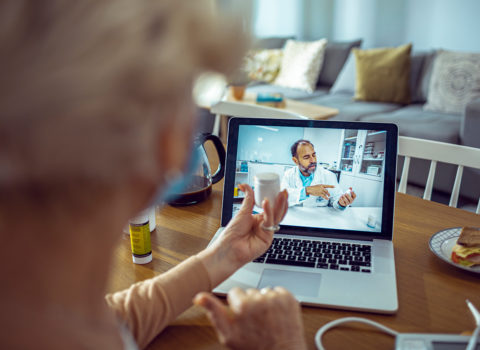 Senior patient shares remote patient monitoring information with doctor on telehealth meeting