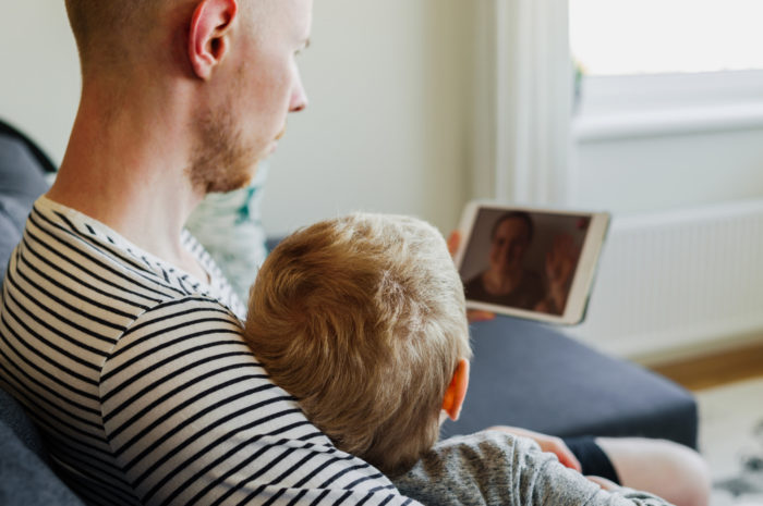 Father and daughter on a videocall with a mother who is currently incarcerated