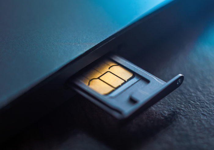 Upclose shot of a sim card inside a tray to connect a custom tablet to a private network