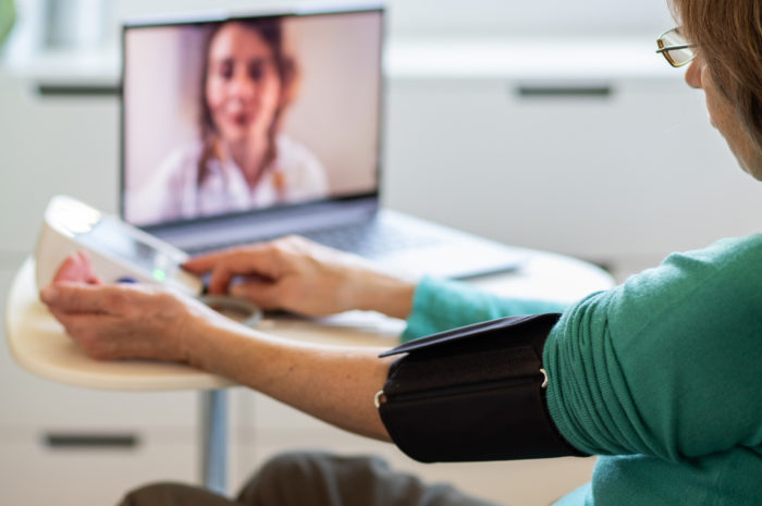 Senior woman on a telehealth call doctor reviewing blood pressure results and testing